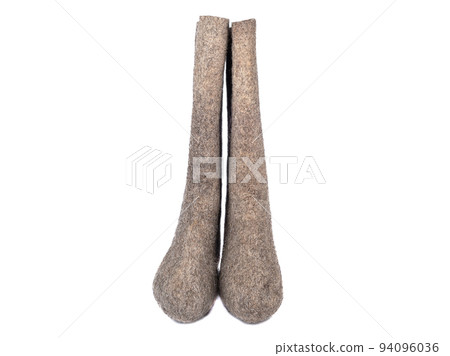 Pair of felt boots on a white background with space for text. 94096036