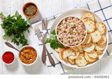 classic ham salad with crackers on white plate 94098981