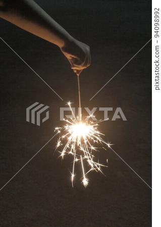 hand with fireworks 94098992