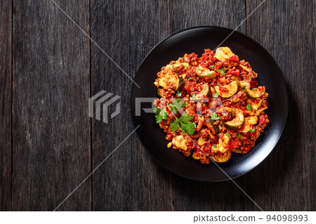 tasty Polenta Ground beef Casserole on black plate 94098993