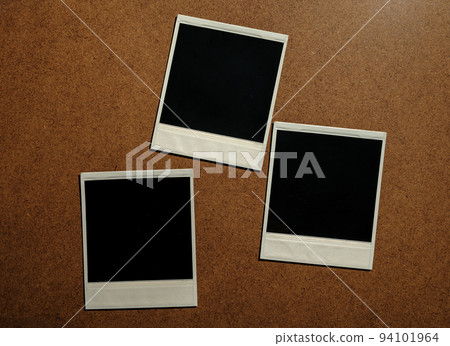 Three blank photo frames on brown table Three blank photo frames on brown table 94101964