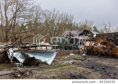 Irpin, Kyev region Ukraine - 09.04.2022: Cities of Ukraine after the Russian occupation. Destroyed military equipment on the streets of the city. Lots of burnt and shelled vehicles. 94104036