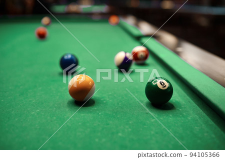 Billiard balls on pool table selective focus Billiard balls on pool table selective focus 94105366