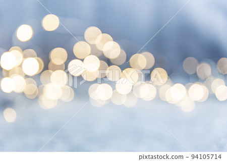 Glowing bokeh wave on a blue background. Christmas light, magic, glitter, celebration. A universal beautiful background with blur in gentle colors. Background for websites, designers. 94105714
