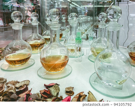perfumes in transparent flasks with a lid. creation of a fragrant flower composition in a flask with fragrance 94105792