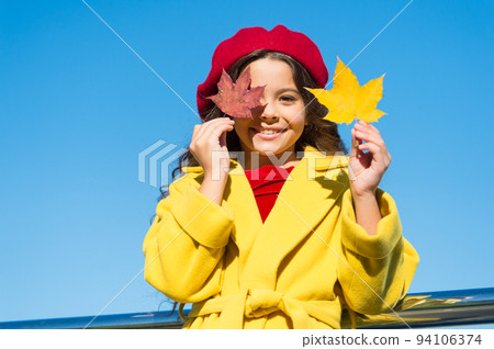 Child with autumn maple leaves walk. Autumn coziness is just around. Little girl excited about autumn season. Autumn warm season pleasant moments. Kid girl smiling face hold leaves sky background Child with autumn maple leaves walk. Autumn coziness is just around. Little girl excited about autumn season. Autumn warm season pleasant moments. Kid girl smiling face hold leaves sky background 94106374