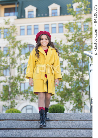 Girl walk defocused background. Charming little french style fashionable girl. Hat accessory french fashion detail. Kid girl bright hat beret. Autumn hat fashion accessory. French trend fall season 94106375