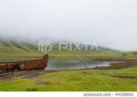 Shipwreck from Mjoifjordur fiord, east Iceland. Icelandic panorama Shipwreck from Mjoifjordur fiord, east Iceland. Icelandic panorama 94106691