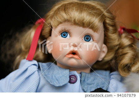 Portrait of a vintage doll at the flea market Portrait of a vintage doll at the flea market 94107879