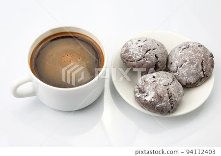 white Cup of black coffee with biscuits on white background. white Cup of black coffee with biscuits on white background. 94112403