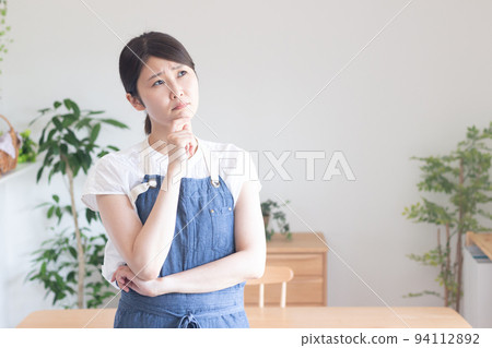 A woman with a troubled look A woman with a troubled look 94112892