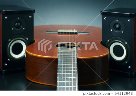 two stereo audio speakers and classical acoustic guitar two stereo audio speakers and classical acoustic guitar 94112948