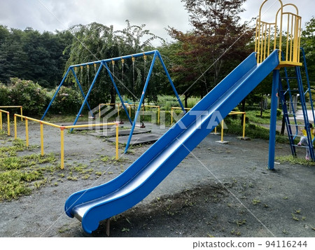 Park playground equipment that is often played|Slides and swings Park playground equipment that is often played|Slides and swings 94116244