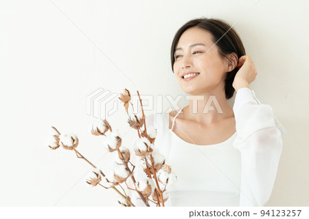 Woman with cotton flower Woman with cotton flower 94123257