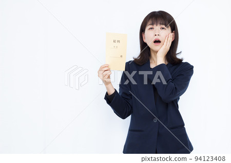 A business woman in her thirties who is surprised with a salary bag A business woman in her thirties who is surprised with a salary bag 94123408