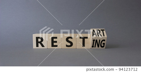 Restart and resting symbol. Turned cubes with words Resting and Restart. Beautiful grey background. Business and Restart and resting concept. Copy space Restart and resting symbol. Turned cubes with words Resting and Restart. Beautiful grey background. Business and Restart and resting concept. Copy space 94123712