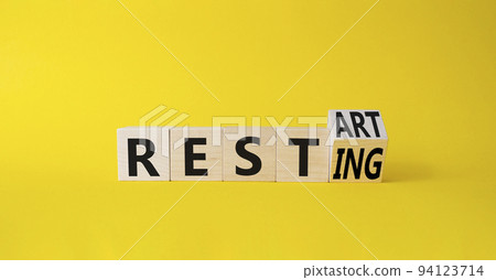 Restart and resting symbol. Turned cubes with words Resting and Restart. Beautiful yellow background. Business and Restart and resting concept. Copy space Restart and resting symbol. Turned cubes with words Resting and Restart. Beautiful yellow background. Business and Restart and resting concept. Copy space 94123714