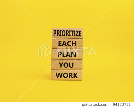 Priority, plan and work symbol. Wooden blocks with words Prioritize each plan you work. Beautiful yellow background. Business and Prioritize each plan you work concept. Copy space Priority, plan and work symbol. Wooden blocks with words Prioritize each plan you work. Beautiful yellow background. Business and Prioritize each plan you work concept. Copy space 94123731