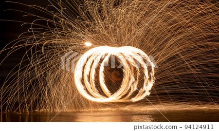 Fire dancers Swing fire dancing show fire show on the beach Fire dancers Swing fire dancing show fire show on the beach 94124911