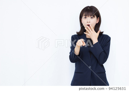 A surprised business woman in her thirties A surprised business woman in her thirties 94125631