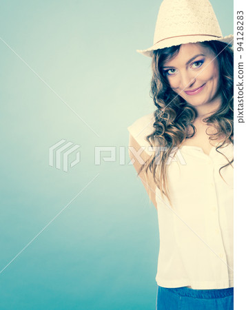 Charming woman in summer clothes straw hat Charming woman in summer clothes straw hat 94128283