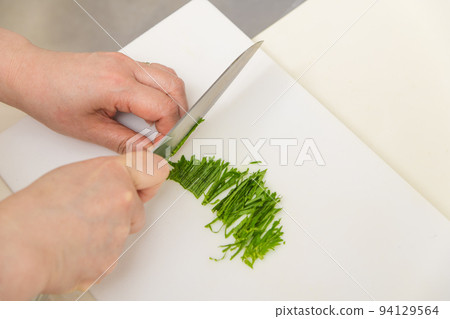 [Santoku knives cut the perilla into thin strips to make condiments] 94129564