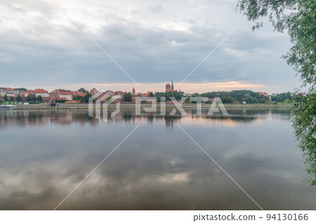 Morning view on panorama of Old Town of Torun seen from the Vistula river in Poland. 94130166