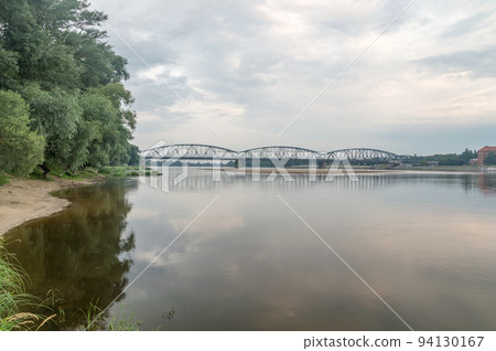 Jozef Pilsudski Bridge over Vistula River in the morning in Torun in Poland. Jozef Pilsudski Bridge over Vistula River in the morning in Torun in Poland. 94130167