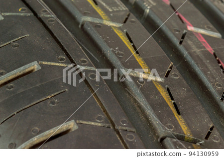 Detail on black car tire. 94130959