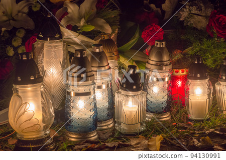 Cemetery candles at All Souls' Day, also known as the Commemoration of All the Faithful Departed and the Day of the Dead. Cemetery candles at All Souls' Day, also known as the Commemoration of All the Faithful Departed and the Day of the Dead. 94130991