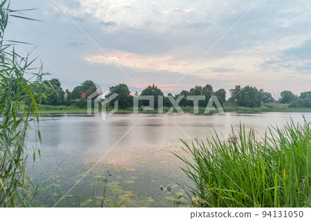 Sunset on Nogat river in Malbork, Poland. Sunset on Nogat river in Malbork, Poland. 94131050