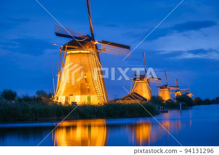 Kinderdijk National Park in the Netherlands. Windmills at dusk. 94131296