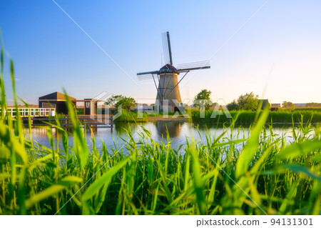 Kinderdijk National Park in the Netherlands. Windmills at the day time. Kinderdijk National Park in the Netherlands. Windmills at the day time. 94131301