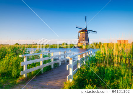 Kinderdijk National Park in the Netherlands. Windmills at the day time. Kinderdijk National Park in the Netherlands. Windmills at the day time. 94131302