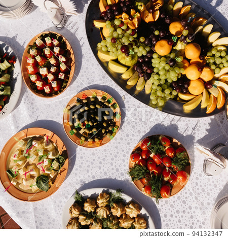 vegetarian festive table with fruits and vegetables vegetarian festive table with fruits and vegetables 94132347