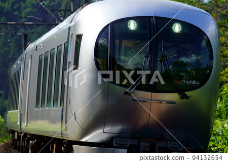 The Seibu Limited Express Laview (close-up) running reflecting the scenery of the foot of Mt. Chichibu 94132654