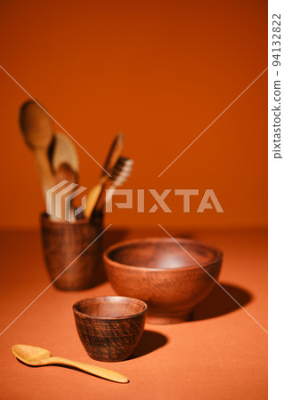 Set of clay bowls on orange background Set of clay bowls on orange background 94132822