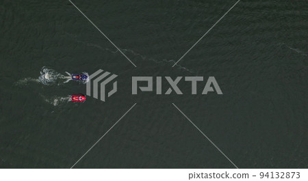 Two speed boats on water, top view. Aerial view sport motor boat and scooter. 94132873