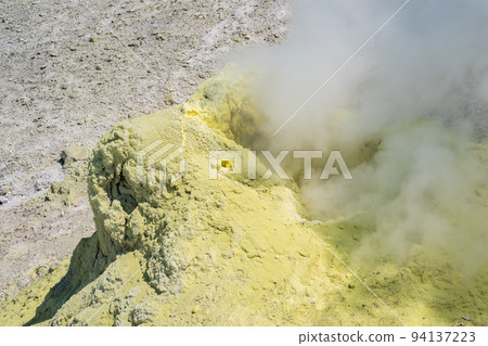 steaminf fumarola in a solfataric field on a slope of the volcano 94137223