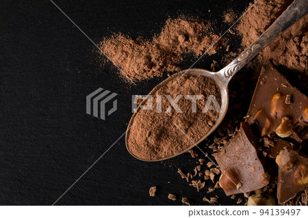 Broken chocolate nuts pieces Broken chocolate nuts pieces 94139497