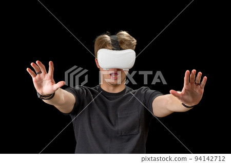 Portrait of a young man with 3D virtual reality glasses. Young man using vr headset, VR goggles Portrait of a young man with 3D virtual reality glasses. Young man using vr headset, VR goggles 94142712