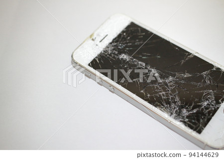 Close up of cracked smartphone screen Close up of cracked smartphone screen 94144629