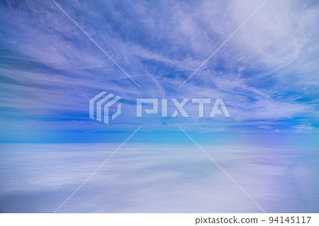 Blue sky and white clouds seen from an airplane Blue sky and white clouds seen from an airplane 94145117