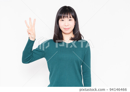 Woman showing the number 3 by hand Woman showing the number 3 by hand 94146466