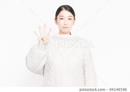 Woman showing the number 4 by hand Woman showing the number 4 by hand 94146596