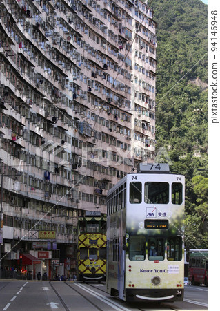 Tram in front of Monster Mansion in Hong Kong / Quarry Bay Tram in front of Monster Mansion in Hong Kong / Quarry Bay 94146948