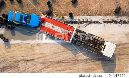 Aerial top view slide car service after dangerous accident on the road, Accident car slide on truck for move. Aerial top view slide car service after dangerous accident on the road, Accident car slide on truck for move. 94147351