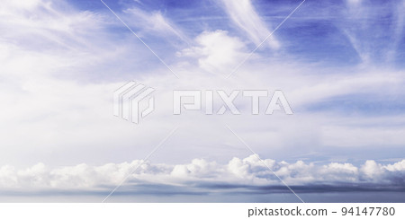 Atmosphere panorama real photo beauty nature wallpaper. Fantastic sky view clouds cumulus cirrus stratus line. Wallpaper design background like painted fairy tale mood. White pale blue purple tone Atmosphere panorama real photo beauty nature wallpaper. Fantastic sky view clouds cumulus cirrus stratus line. Wallpaper design background like painted fairy tale mood. White pale blue purple tone 94147780
