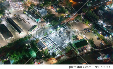 Aerial view of petrochemical oil refinery and sea in industrial engineering concept in Bangna district at night, Bangkok City, Thailand. Oil and gas tanks pipelines in industry. Modern metal factory. 94149943
