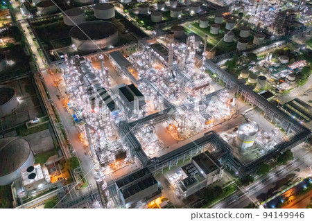 Aerial view of petrochemical oil refinery and sea in industrial engineering concept in Bangna district at night, Bangkok City, Thailand. Oil and gas tanks pipelines in industry. Modern metal factory. 94149946
